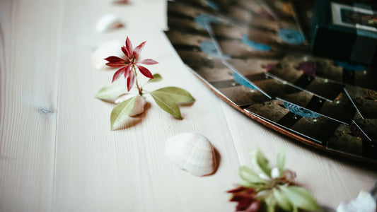 Flowers around a deck of cards on the floor