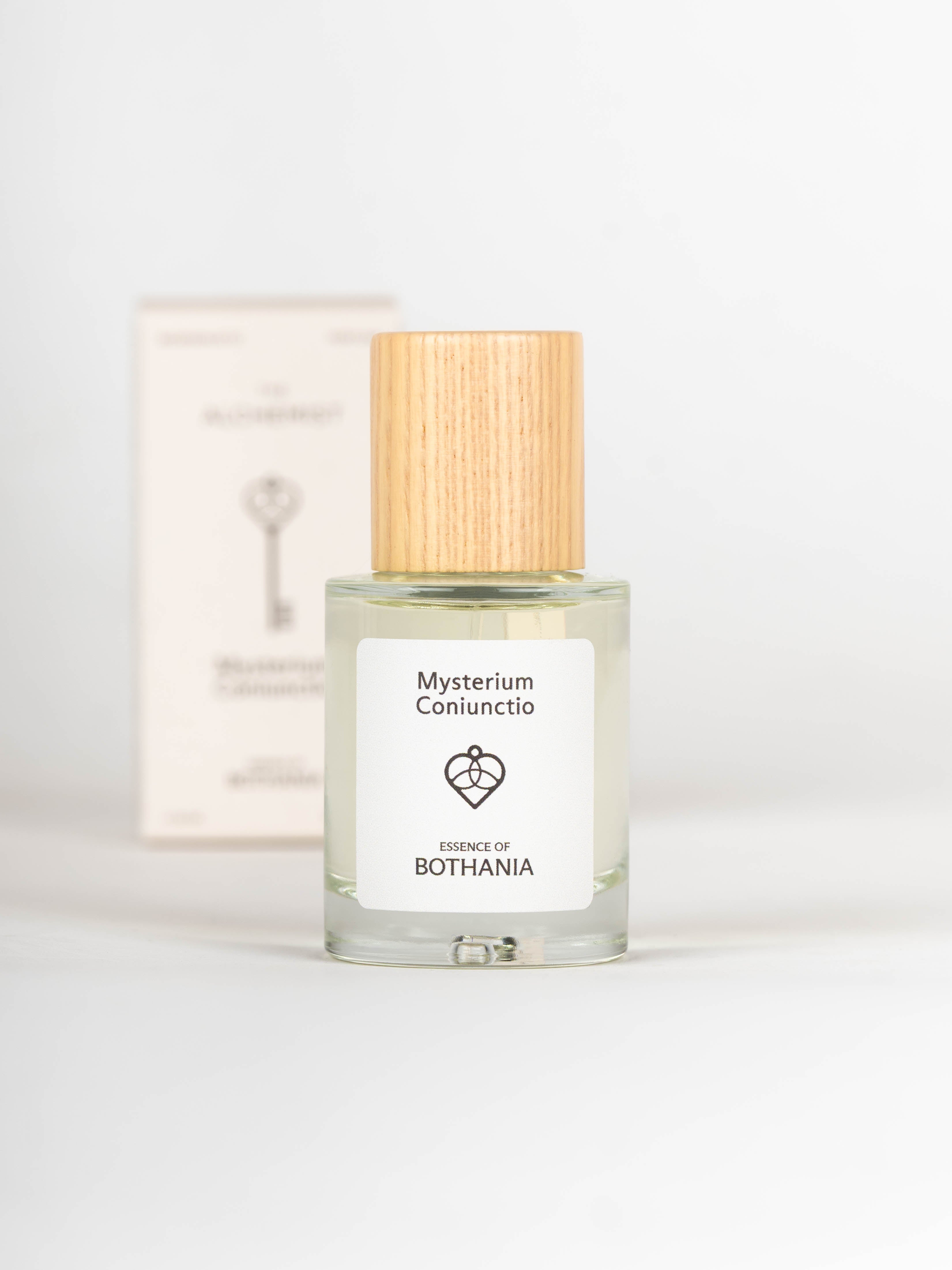 Bottle of Mysterium Coniunctio perfume with wooden cap on a white background