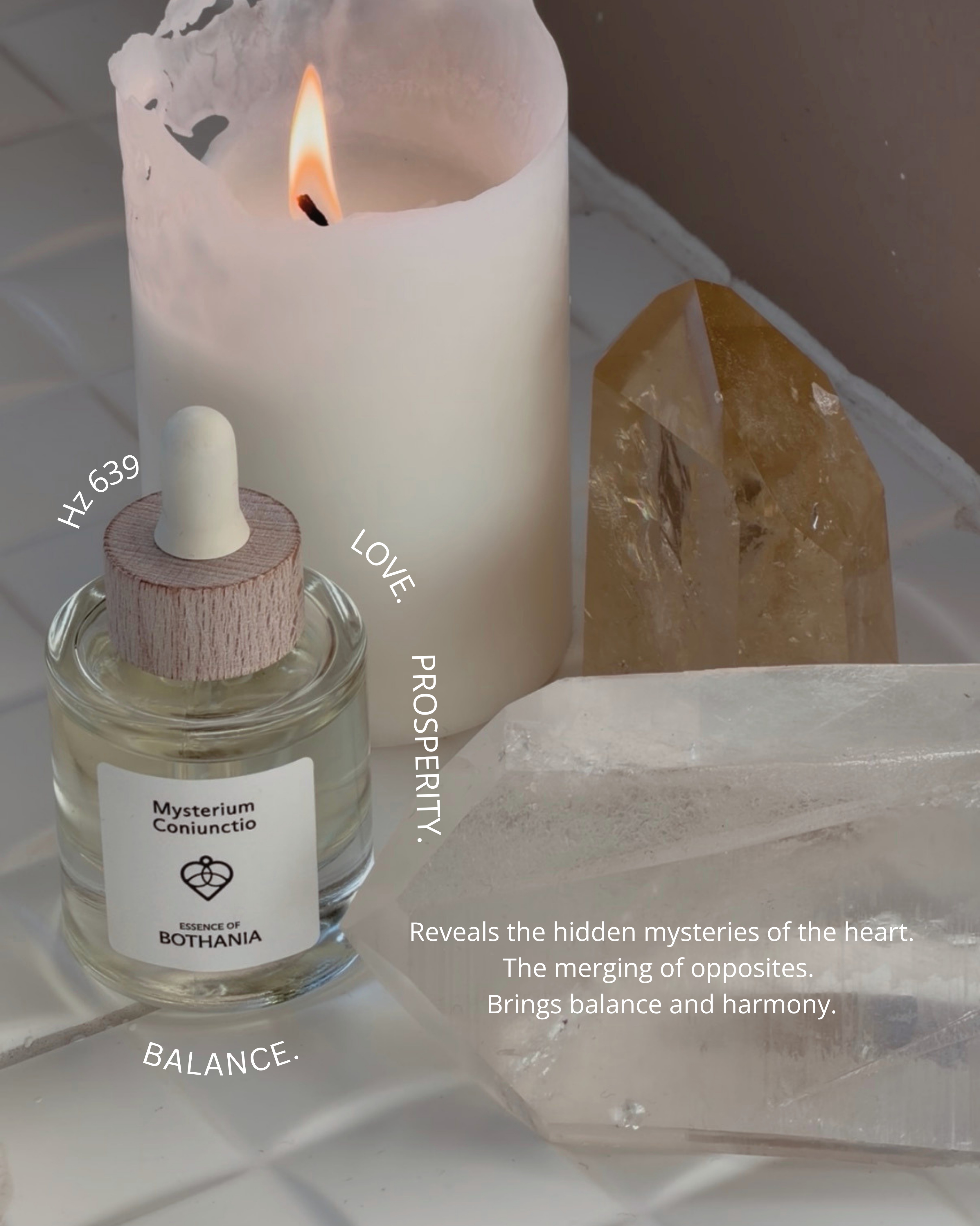 Bottle of Mysterium Coniunctio with a lit candle and crystals on a neutral background. Bio-energetic perfume oil made by House of Bothania, made to awaken your senses. 'Mysterium Coniunctio' is connected to our heart chakra, is represents balance, love and prosperity. It reveals the hidden mysteries of the heart. The merging of opposites. Brings balance and harmony.